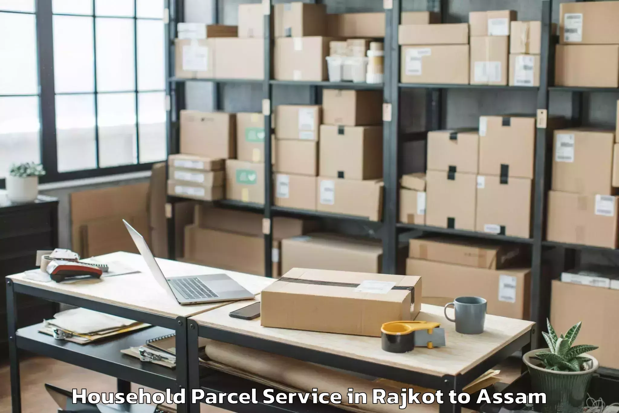 Hassle-Free Rajkot to Kharupetia Household Parcel